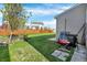 This backyard features a spacious lawn and a charming wooden fence, perfect for outdoor activities and relaxation at 612 Reunion Ln, Greenwood, IN 46143