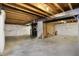 Unfinished basement with exposed beams, utilities, and ample space for customization at 612 Reunion Ln, Greenwood, IN 46143