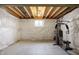 Unfinished basement featuring concrete floor, insulated walls, exposed ceiling and included exercise machine at 612 Reunion Ln, Greenwood, IN 46143