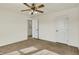 Bedroom featuring carpet, a ceiling fan, and a view to the hallway at 612 Reunion Ln, Greenwood, IN 46143
