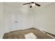 Bedroom featuring carpet, a ceiling fan, and double doors to a closet at 612 Reunion Ln, Greenwood, IN 46143
