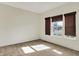 Well-lit bedroom featuring neutral carpeting, a window with shade coverings, and ample natural light at 612 Reunion Ln, Greenwood, IN 46143