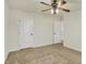 Bedroom featuring carpet, a ceiling fan, and a white closet door at 612 Reunion Ln, Greenwood, IN 46143