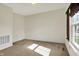 Bright bedroom with neutral carpeting, a window with woven shades, and neutral paint at 612 Reunion Ln, Greenwood, IN 46143
