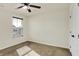 A cozy bedroom with neutral carpet, ceiling fan, and a window with blinds at 612 Reunion Ln, Greenwood, IN 46143
