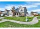 Inviting two story home featuring beautiful lawn, landscaping, and sidewalk leading to the front door at 612 Reunion Ln, Greenwood, IN 46143