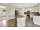 Modern kitchen with stainless steel appliances, granite counters, and ample cabinetry at 612 Reunion Ln, Greenwood, IN 46143