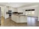 Modern kitchen with stainless appliances and a view to an outdoor dining patio at 612 Reunion Ln, Greenwood, IN 46143