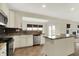 Bright kitchen with stainless steel appliances and an island counter perfect for entertaining at 612 Reunion Ln, Greenwood, IN 46143