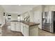Kitchen island with stainless steel appliances and an open floor plan at 612 Reunion Ln, Greenwood, IN 46143