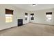 Spacious living room with a cozy fireplace and bright windows at 612 Reunion Ln, Greenwood, IN 46143