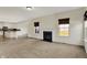 Spacious living room with a cozy fireplace adjacent to an open kitchen concept, perfect for entertaining at 612 Reunion Ln, Greenwood, IN 46143