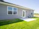 Backyard view featuring a patio, siding, and well-maintained lawn at 6272 Wasco Dr, Whitestown, IN 46075