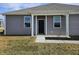 Gray townhome with a black front door and white columns at 6272 Wasco Dr, Whitestown, IN 46075