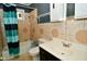 Bathroom features decorative tile, shower-tub combination, toilet, and vanity with a sink at 850 S Holmes Ave, Indianapolis, IN 46221