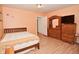 Cozy bedroom featuring a double bed and vintage dresser at 850 S Holmes Ave, Indianapolis, IN 46221