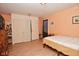 Bedroom featuring double closets, hard surface floors and neutral paint at 850 S Holmes Ave, Indianapolis, IN 46221