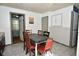 Cozy dining room featuring tile flooring, a checkered tablecloth, and a neutral wall color at 850 S Holmes Ave, Indianapolis, IN 46221