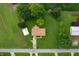 Aerial view of property showcasing the house, surrounded by trees and farmland at 1504 N Knightstown Rd, Shelbyville, IN 46176