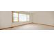 Bright bedroom featuring neutral carpet and a large window at 1504 N Knightstown Rd, Shelbyville, IN 46176
