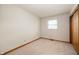 Bedroom features a closet and a window with blinds, providing comfort and practicality at 1504 N Knightstown Rd, Shelbyville, IN 46176