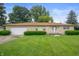 Charming one-story ranch with a large front yard and attached garage at 1504 N Knightstown Rd, Shelbyville, IN 46176