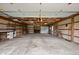 Spacious garage interior with ample storage shelves and workbench areas at 1504 N Knightstown Rd, Shelbyville, IN 46176