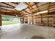 Open garage interior features built-in shelving and concrete floors at 1504 N Knightstown Rd, Shelbyville, IN 46176