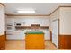 Traditional kitchen with white cabinetry and a functional island at 1504 N Knightstown Rd, Shelbyville, IN 46176