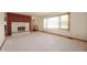 Spacious living room with a stone fireplace and large window at 1504 N Knightstown Rd, Shelbyville, IN 46176