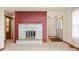 Inviting living room featuring a stone fireplace and neutral carpet at 1504 N Knightstown Rd, Shelbyville, IN 46176