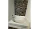 Close-up of a bathtub with tiled walls and modern faucet at 2307 Blackthorn Dr, Franklin, IN 46131