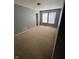 This carpeted bedroom has natural light and a closet at 2307 Blackthorn Dr, Franklin, IN 46131