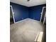 Bedroom featuring large carpeted area, blue wall, and two door entrances at 2307 Blackthorn Dr, Franklin, IN 46131