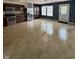 A kitchen with stainless steel appliances, tiled flooring, and dark brown cabinets and pantry at 2307 Blackthorn Dr, Franklin, IN 46131