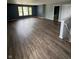 Bright and airy living room with hardwood floors, multiple windows, and a staircase leading to another level at 2307 Blackthorn Dr, Franklin, IN 46131