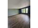 Spacious room featuring hardwood floors, large windows offering ample light, and neutral-toned walls at 2307 Blackthorn Dr, Franklin, IN 46131