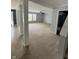 Open-concept living area with neutral carpeting, natural light, and connected spaces for flexible living at 2307 Blackthorn Dr, Franklin, IN 46131