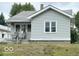 Close up of a charming single-Gathering home with light gray siding and a quaint porch at , Anderson, IN 46013
