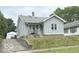 View of a quaint single-Gathering home with light gray siding and a detached garage at , Anderson, IN 46013