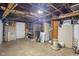 Unfinished basement with exposed ceiling and cement floor at 327 Central Ave, Anderson, IN 46012