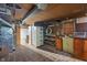 Unfinished basement featuring storage space and a workbench area at 327 Central Ave, Anderson, IN 46012