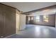 Basement with paneled walls, painted floor and natural light from windows at 327 Central Ave, Anderson, IN 46012
