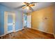 Bedroom featuring wood floors and two doors, one blue and one white at 327 Central Ave, Anderson, IN 46012