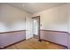 Empty bedroom with hardwood floors and natural light from a window at 327 Central Ave, Anderson, IN 46012