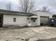 Exterior facade of house with vinyl siding, stone foundation and garage at 850 N Anderson St, Elwood, IN 46036