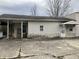 Front view of home with vinyl siding, stone accents and porch area at 850 N Anderson St, Elwood, IN 46036