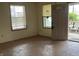 Open living room area with windows and entry to front porch at 850 N Anderson St, Elwood, IN 46036