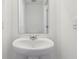 Powder room features a pedestal sink and a large mirror at 6286 Wasco Dr, Whitestown, IN 46075