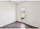 Bedroom featuring hardwood floors, white walls, and a glass-paneled door letting in lots of natural light at 6286 Wasco Dr, Whitestown, IN 46075
